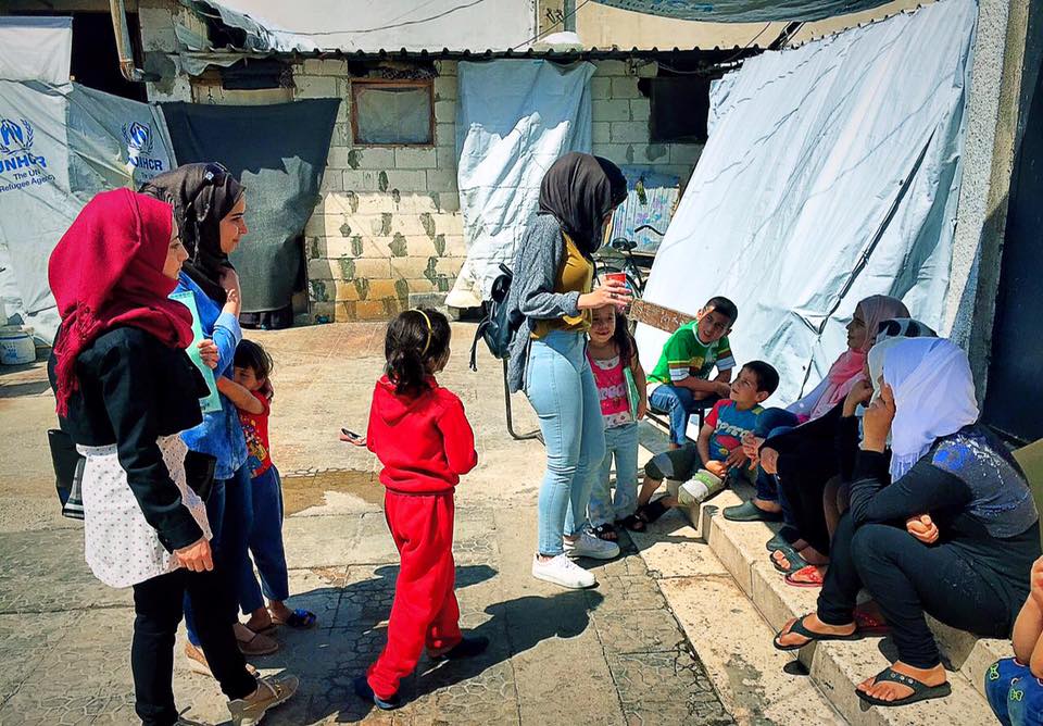 women and children in a refugee camp
