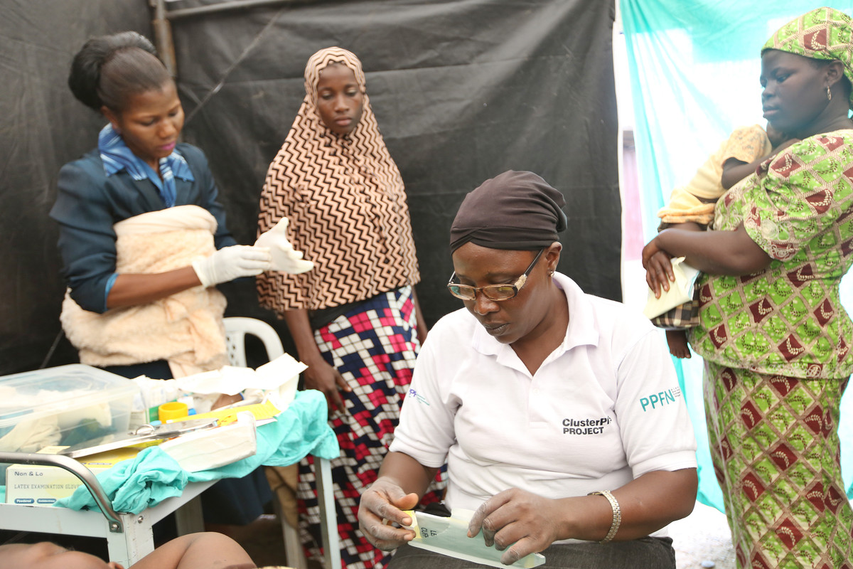 IPPF public health facility worker administers family planning to local clients