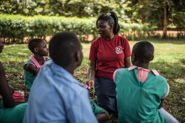 Milly, a teacher and VODA community volunteer, provides information on sexual and reproductive health to pupils at a primary school in Kasawo, Uganda.