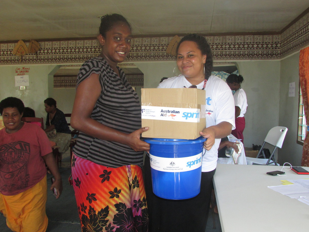 IPPF-SPRINT staff distributing dignity kits