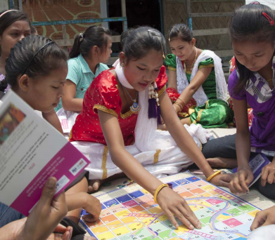 Girls gather to do a workshop