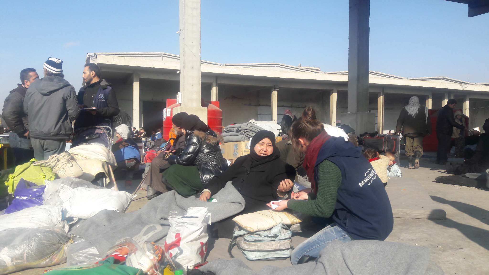 Staff of Syrian Family Planning Association distributing essentials to women. 