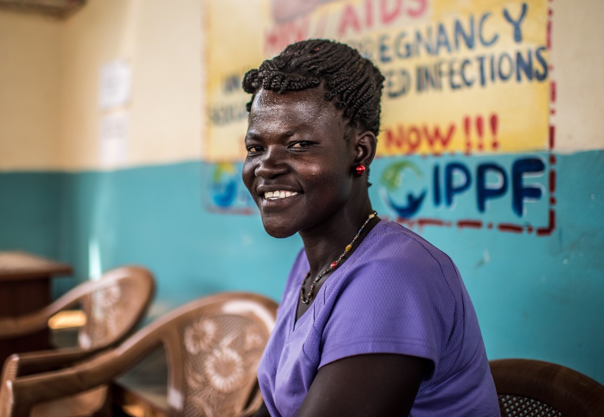 IPPF client from Uganda smiling, waiting for services 