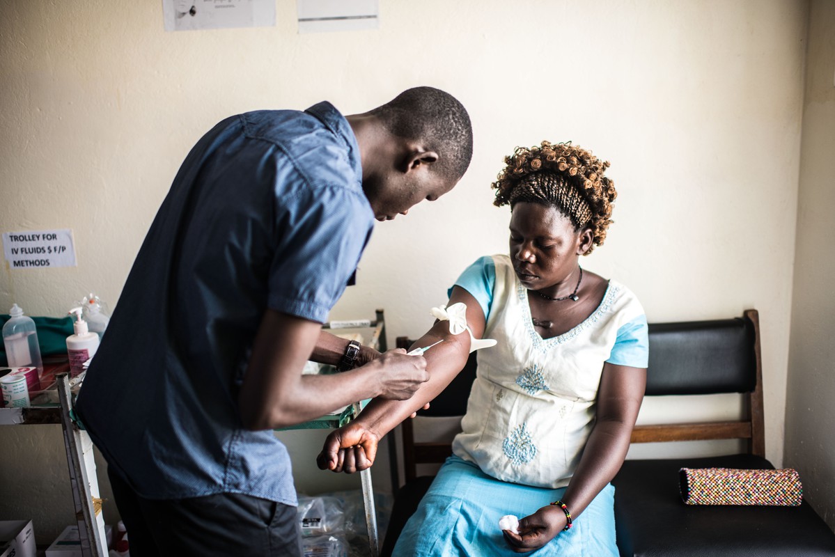 25-year-old Dorcas Lanyero gets blood test during a visit to the RHU clinic in Gulu. Lanyero was suffering from abdominal pain but received a full range of tests while she was there.