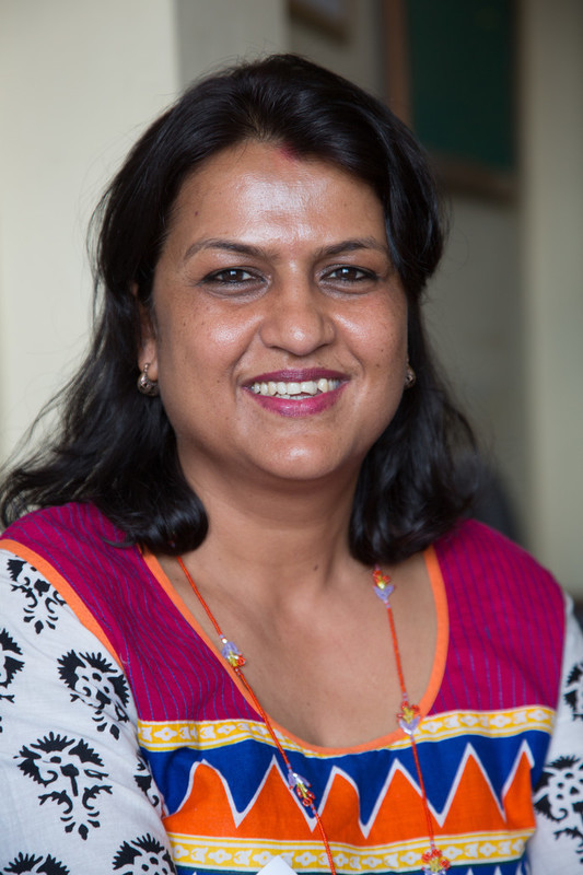 Female staff smiling. 