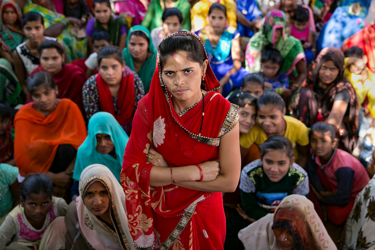 Indian woman standing with arms crossed