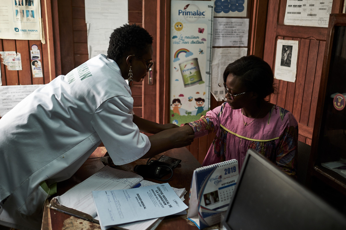 A woman received healthcare in Cameroon