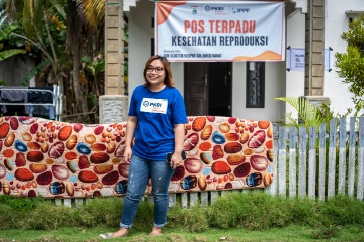 A photo of Dr Ratni - she is smiling in front of a clinic