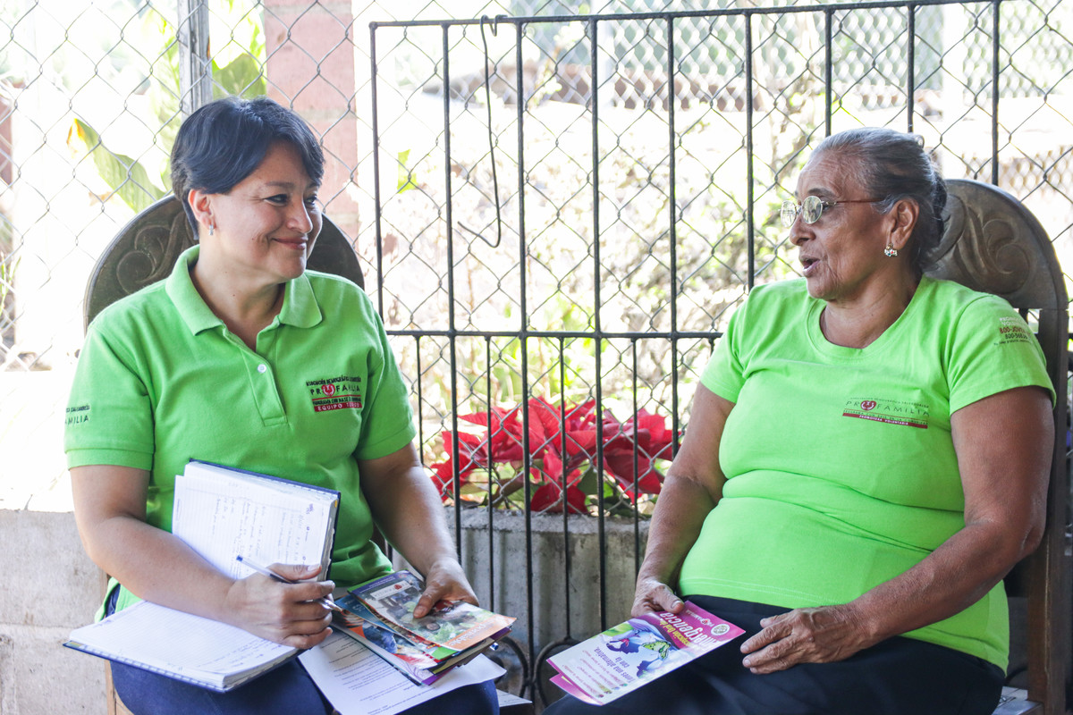 Two healthcare workers talking 