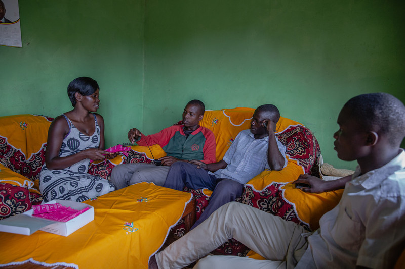 Peer educator with group of young people 