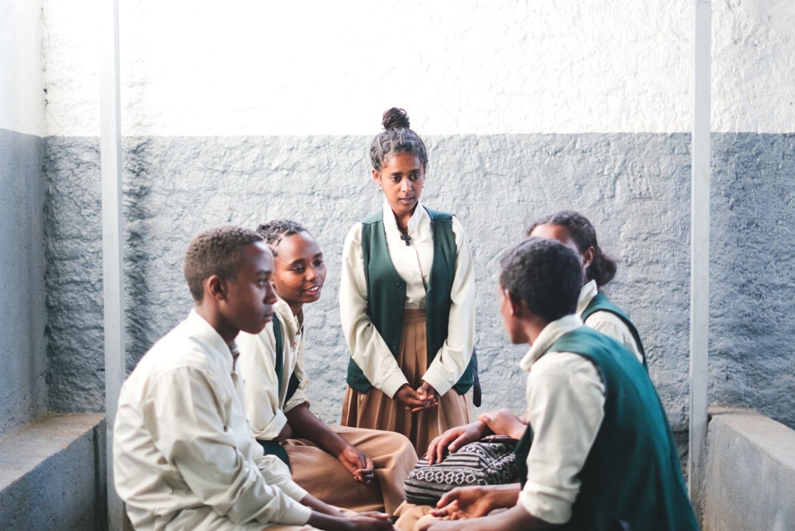 A peer educator in Ethiopia speaks with other young people