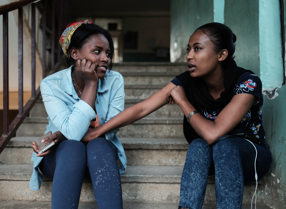 Two young women supporting each other in Ethiopia