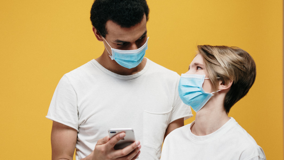 Man and woman wearing face masks