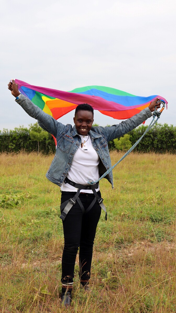 Young person with an LGBTIQ+ flag