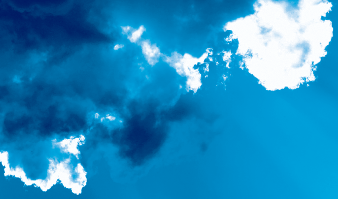 A blue sky with dark blue and white clouds