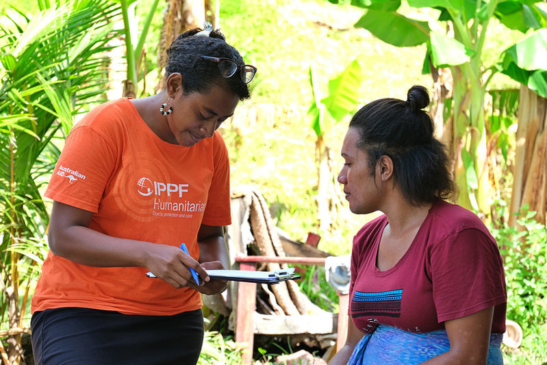 Humanitarian healthcare worker with a client