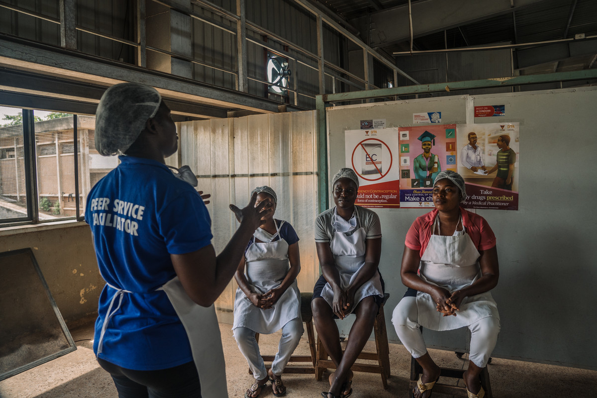 Dorcas Amakyewaa –Mim Cashew Factory worker, 42, is educating her peers on sexual heath topics at Mim Cashew Factory during the work break.