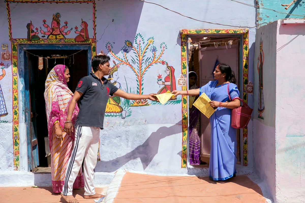 volunteer handing out literature