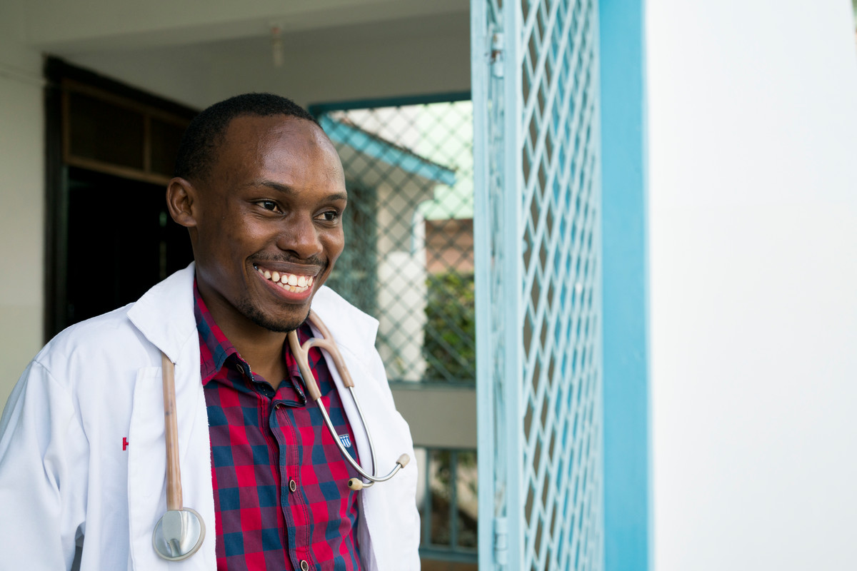 Clinical Officer Adillahi Ali, age 30, stands for a portrait in front of The Family Care Medical Centre (FHOK) in Malindi, Kenya