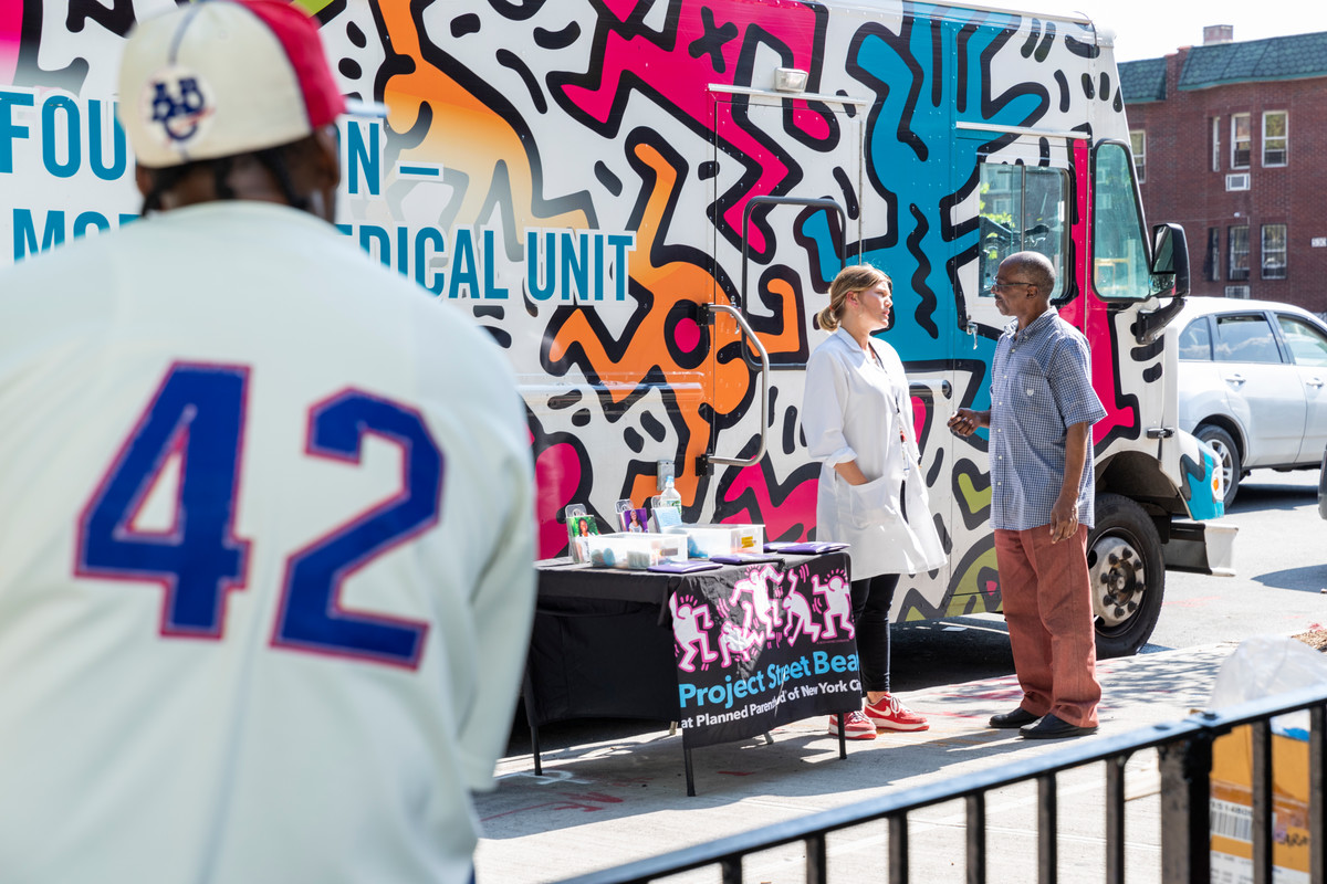 Sarah Zuercher, a women’s health nurse practitioner outside the Keith Haring designed mobile clinic