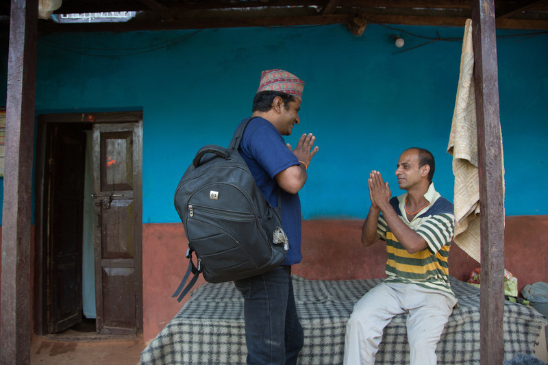 Two men greeting each other. 