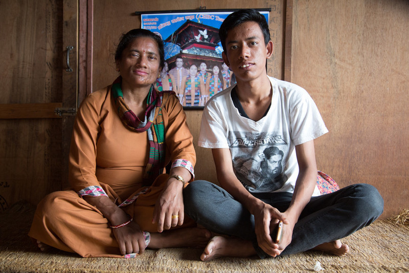 Woman and young man sitting down