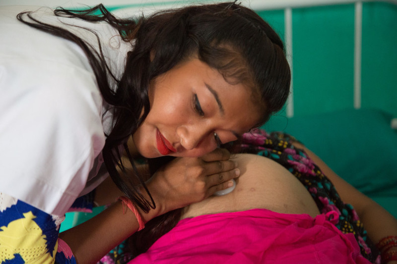 Nurse checking pregnant woman