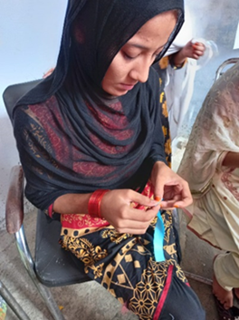 A survivor busy polishing her stitching skills