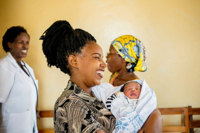 Josiane, 34, finishes her check-up with midwife Regine at ABUBEF clinic in Bujumbura. 