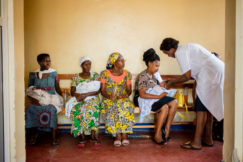 Claudine, Piece with her friend, and Josiane Kayezu, wait for appointments at the ABUBEF clinic in Bujumbura. 