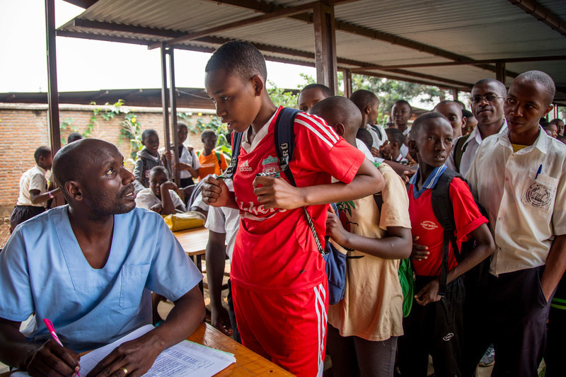 ABUBEF's midwife, Desire Manirakiza, takes the names of students as they wait their turn for the HIV test at Municipal Lycee of Nyakabiga school in Bujumbura. 