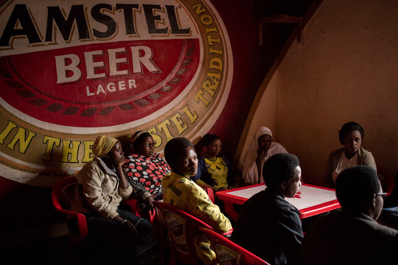 Sitting at a table in the corner of a Kirundo bar laughing, a group of women meet to talk about their peer education work for ABUBEF, and daily life in the province. The women are sex workers and didn’t know each other before, but they have become good friends. During the project the clinic supported them with transport fees, textbooks, and workshops as well as free condoms.  