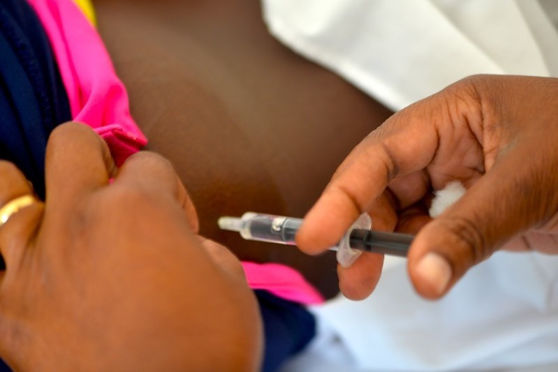 Nurse Julia Suzette Mulambo* administers hormonal contraceptive injection to Eleria Horacio Mabucule.