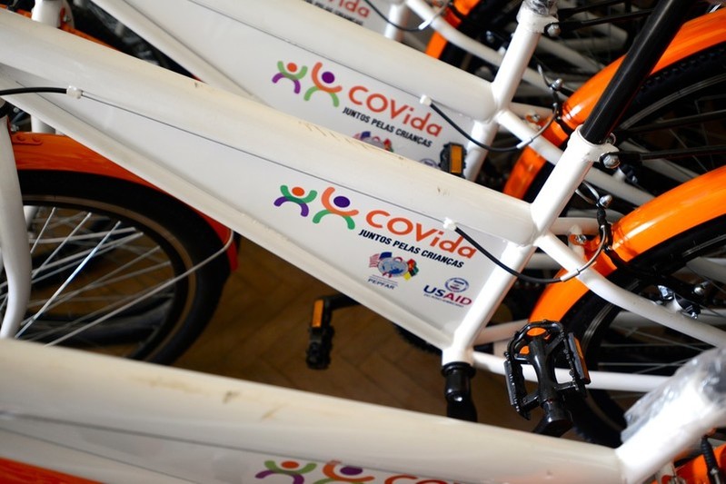 A fresh delivery of bikes for staff and volunteers to use to reach local communities sit piled in a store room. The programmes that use these to deliver services will cease to operate as the funding stops. 