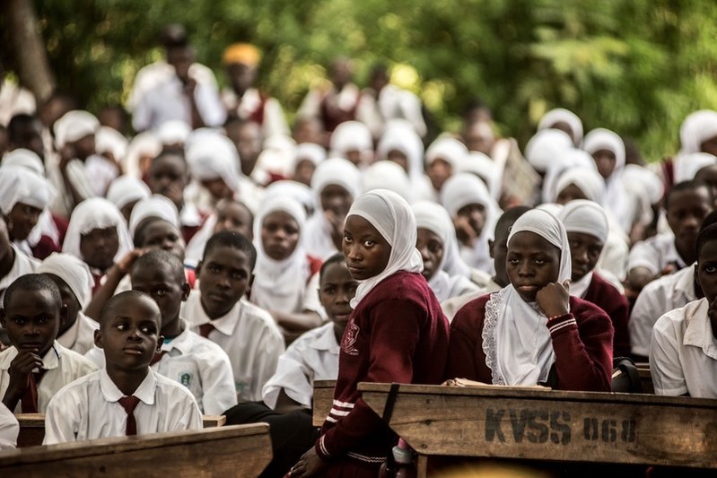 Students at a secondary school in Kasana attend an information session on reproductive health by VODA staff and volunteers.