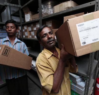 Warehouse workers transporting contraceptive commodities in Bangladesh