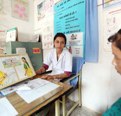 IPPF clinician and female client in Nepal getting sexual health services