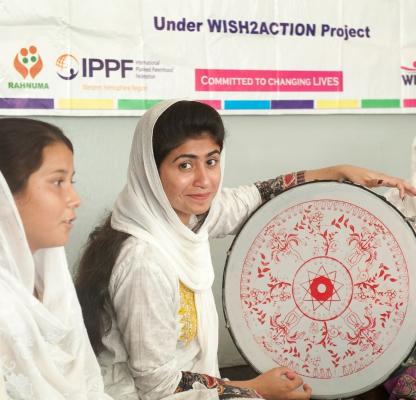 A woman smiles during a youth session