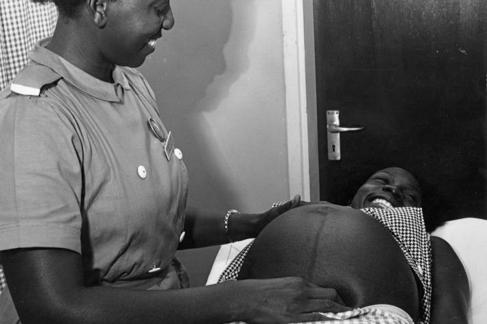 Pregnant women receiving a pre-natal check up at a clinic in Katwe. Uganda, 1970.