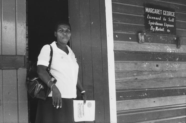Margaret George, one of two GPPA community outreach workers, outside her shop which distributes contraception to the local community. Grenada, 1982