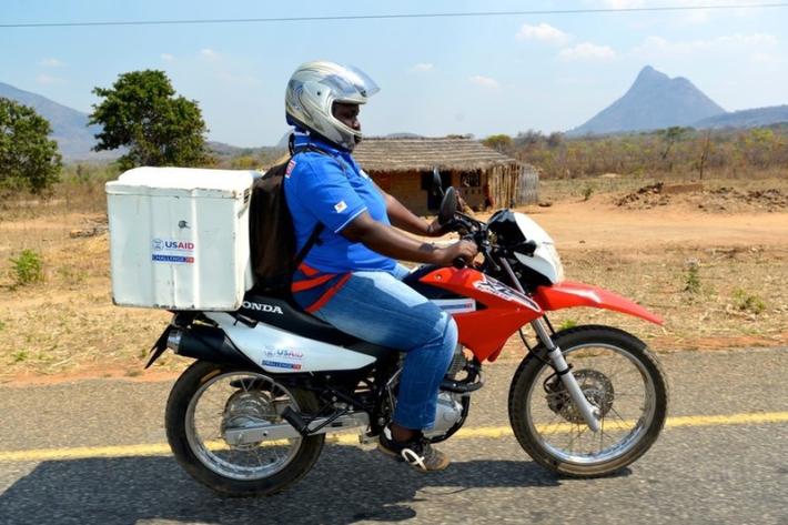 Cacilda Antonio Nimaco picks up a TB sample in rural Ribaue District, Nampula Province, Mozambique. 