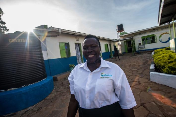 Anishia welcomes clients at RHU's Gulu Clinic. Uganda, 2016