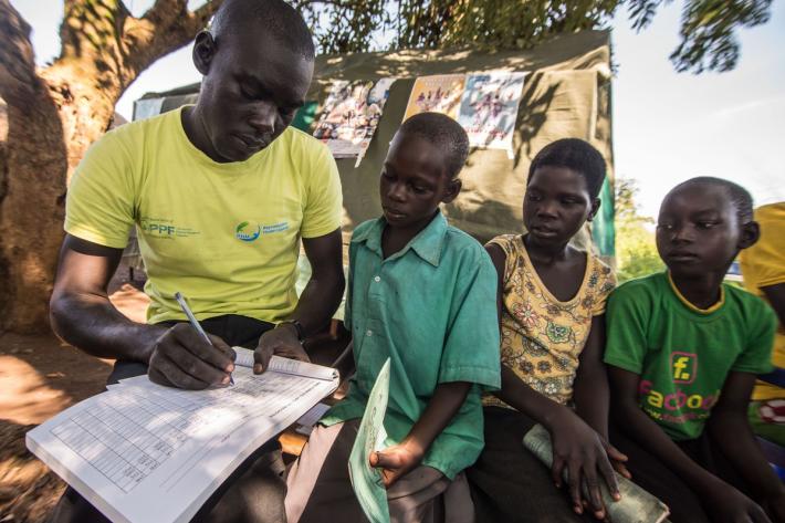 Young children are registered for their vaccinations. 