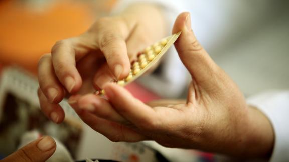 hands holding contraceptive pill blister Credits: Graeme Robertson