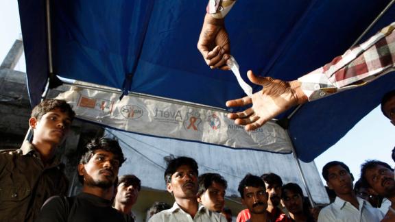 Condom demonstration to a group of men in rural India