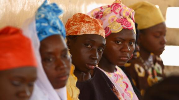 Four black women, looking at the camera. Gambia, ph:Chloe Hall