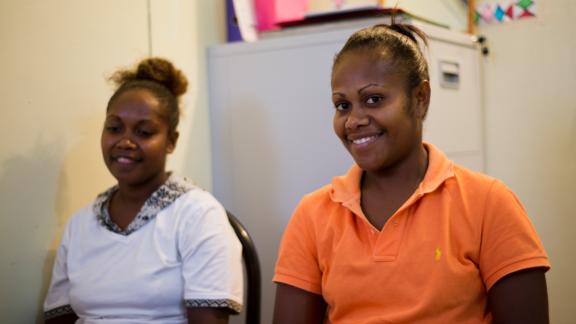 Two girls smiling. Vanuatu Family Health Association 