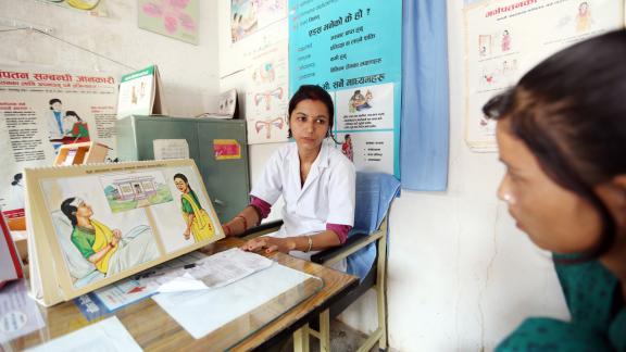 IPPF clinician and female client in Nepal getting sexual health services