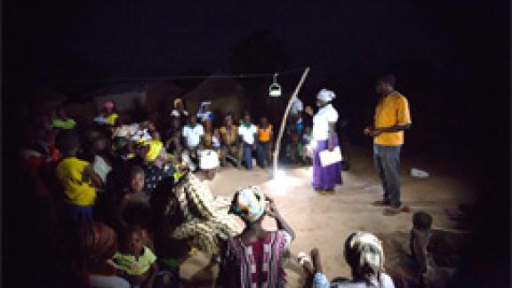 A night meeting in Ghana held using solar lanterns