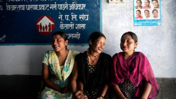 Three women sit together in IPPF clinic in Nepal